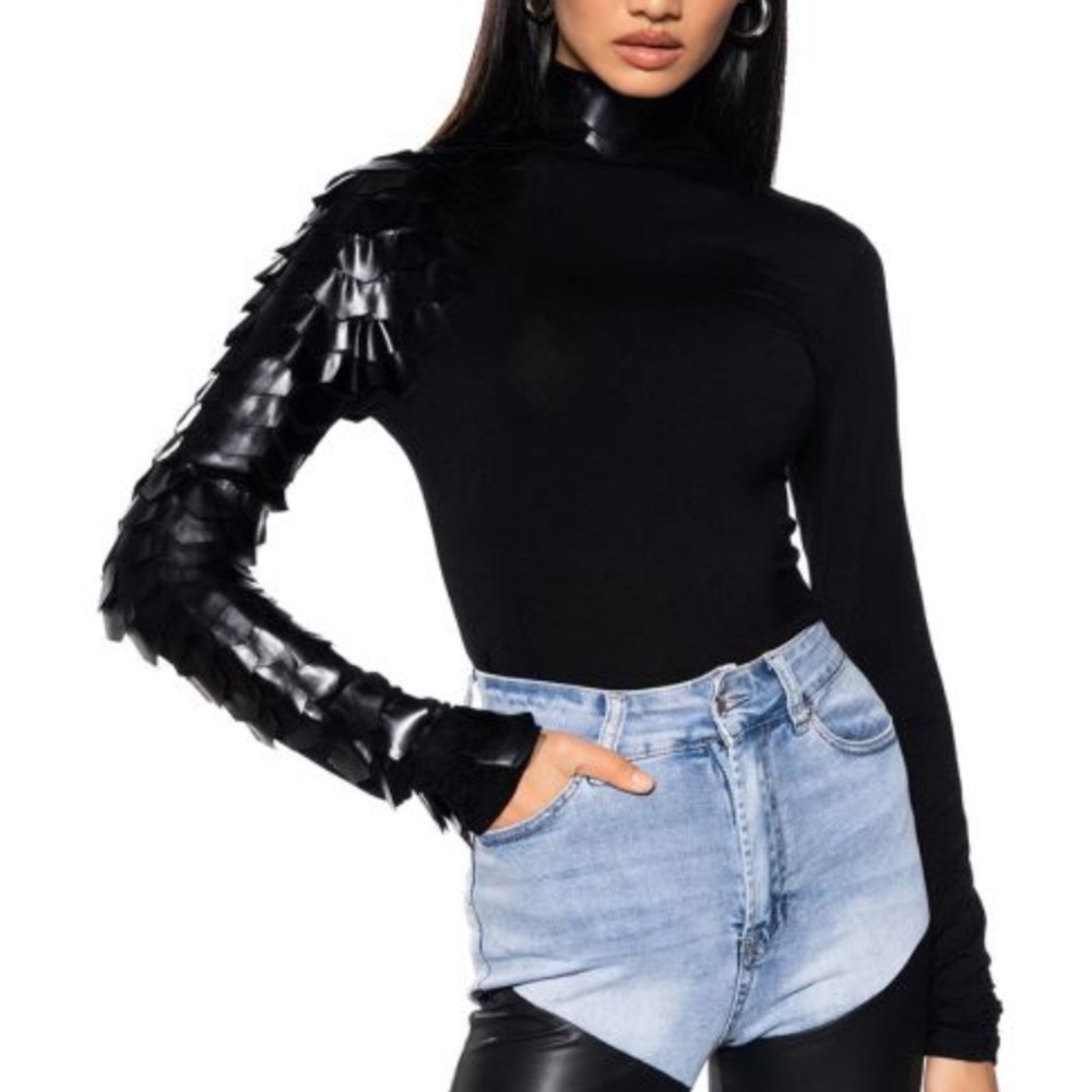 Black long sleeve turtleneck shirt/blouse with a leather arm!